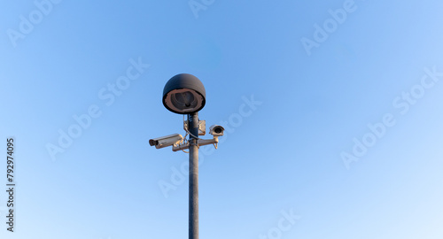 video surveillance cameras filming a public square