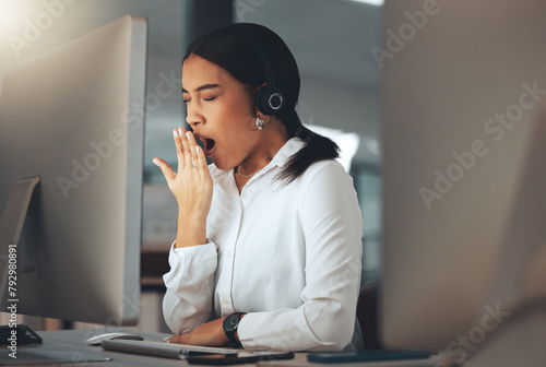 Woman, call centre and yawn at night, burnout and secretary or assistant tired in office. Female person, sleepy and receptionist or fatigue and overworked, exhausted and operator for consulting photo