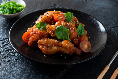 Pork in sweet and sour sauce and sesame seeds. A traditional Chinese dish.
