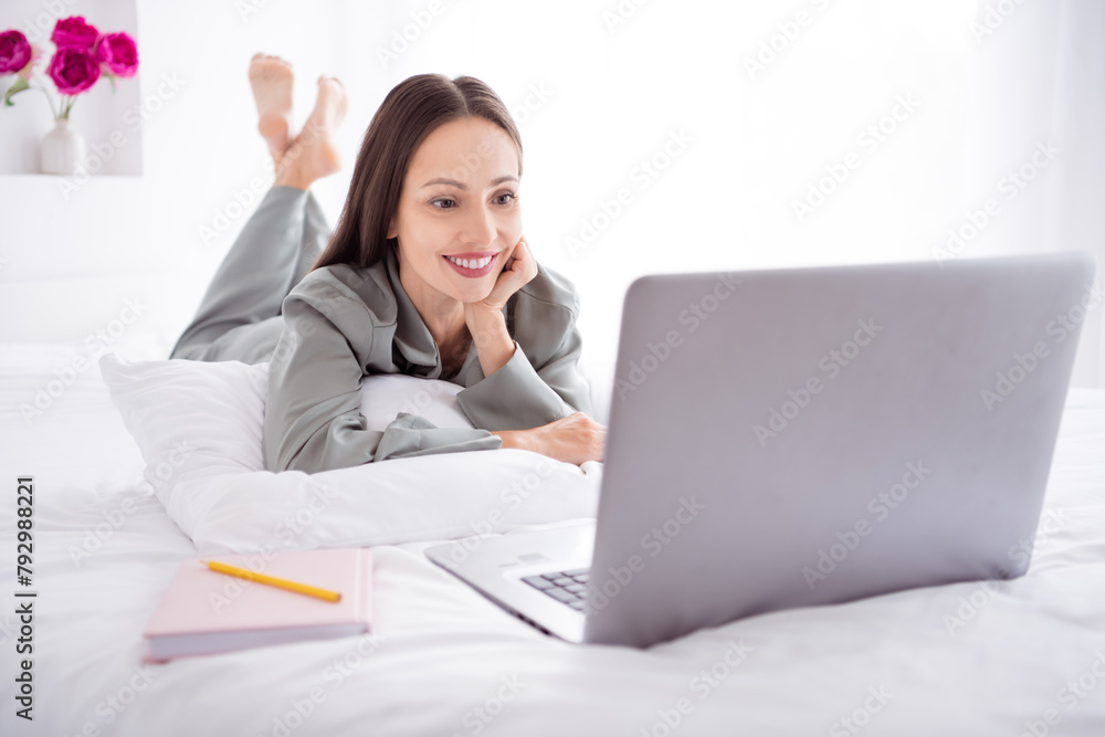 Photo of adorable pretty lady wear grey nightwear distance education apple samsung device indoors apartment bedroom Photo of adorable pretty lady wear grey nightwear distance education apple samsung device indoors apartment bedroom