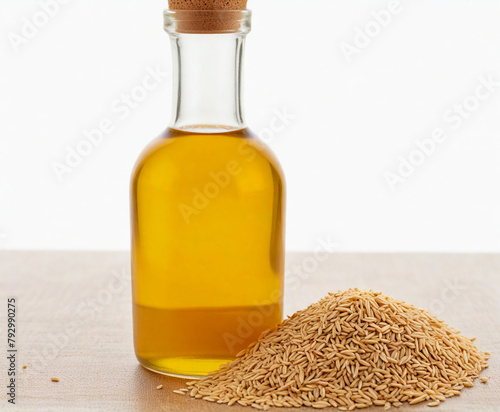 Rice bran oil in bottle glass with seed and bran, cut out on white background