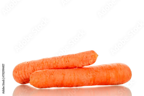 Two sweet carrots, macro, isolated on a white background.