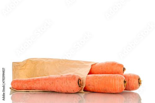 Several sweet carrots with paper bag, macro, isolated on white background.