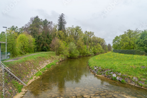 Leiblach river at cloudy day. View on border river between Germany and Austria.