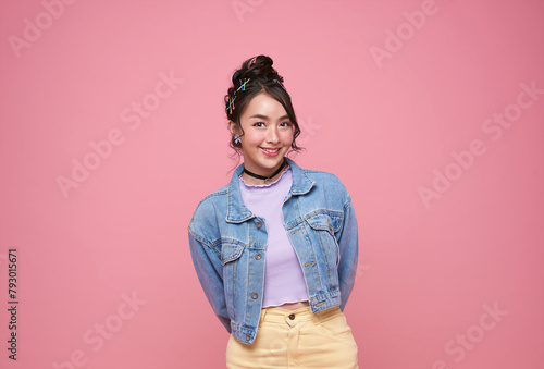 beautiful young Asia girl feel happiness with positive expression, joyful smile, dressed in casual cloth isolated on pink background.