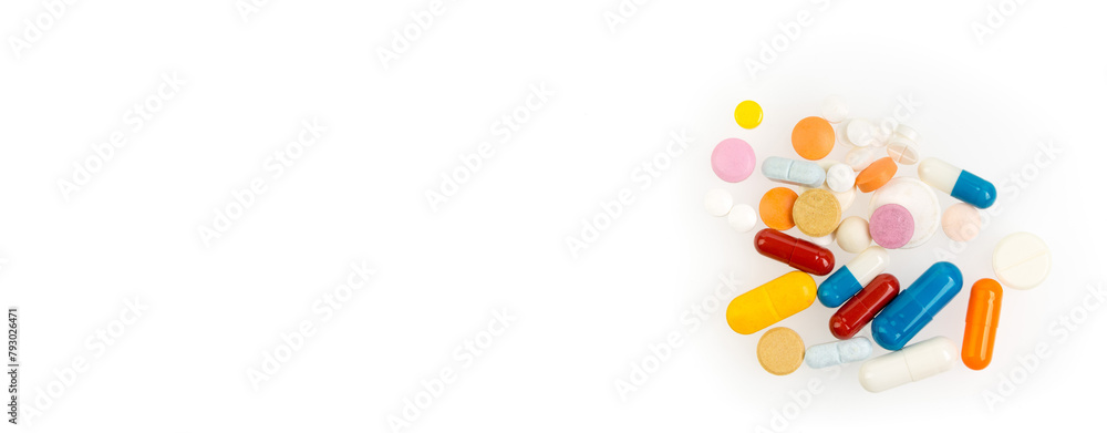 Set of different colorful pills and capsules isolated on white background. Copy space for text.