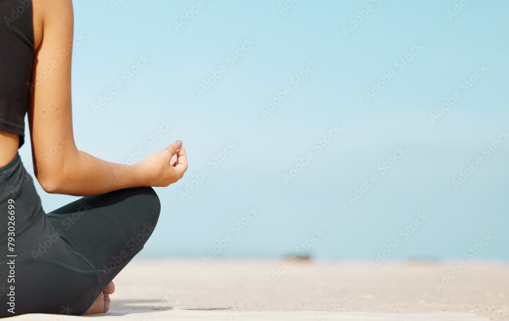 Hands, meditation and yoga with person n on beach for balance, inner peace or wellness in morning. Exercise, mindfulness and space with yogi on sand by ocean or sea for holistic awareness or zen Hands, meditation and yoga with person n on beach for balance, inner peace or wellness in morning. Exercise, mindfulness and space with yogi on sand by ocean or sea for holistic awareness or zen
