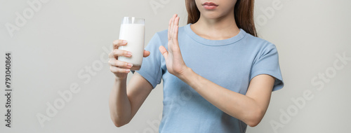 Canvas Print Allergy asian young woman, girl hand in deny, no or push out to avoid for drink milk at home, unhappy and bad stomach ache