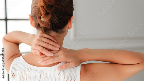 Pain in the neck muscle of Caucasian woman. Nape pain and nuchal stiffness concept. photo