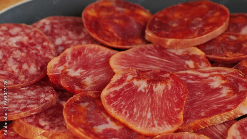Mix of spanish pork sausages, Cutting board of appetizing catalonian snack - fuet, jamon, chorizo, olives, supermarket tapas food in spain, traditional cuisine. Mix of spanish pork sausages, Cutting board of appetizing catalonian snack - fuet, jamon, chorizo, olives, supermarket tapas food in spain, traditional cuisine.