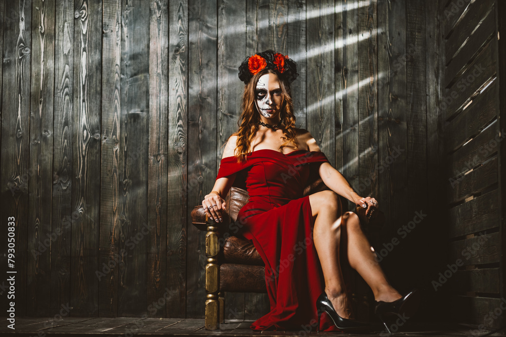 A captivating woman dressed in red with traditional Day of the Dead makeup sits confidently, her pose exuding a mysterious allure. Mysterious Lady with Day of the Dead Makeup