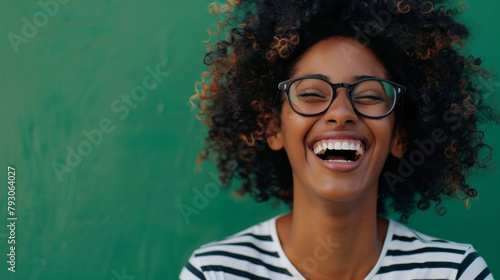 Mockup, laugh and black woman by green background with face, excited or mind blown with good news. Happy, female person or cheerful reaction for announcement, gossip or funny on studio with backdrop