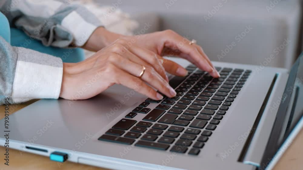 Female hands typing text on a laptop keyboard. Online work from home Female hands typing text on a laptop keyboard. Online work from home