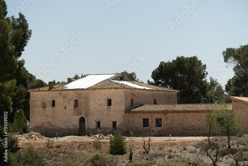 Beautiful abandoned country house in the forest, on a sunny morning
