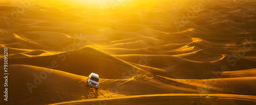 Dubai desert safari in sunset light. Off road safari in sand desert banner. Empty Quarter Desert in United Arab Emirates. Offroader on dunes in Rub’ al Khali desert. photo