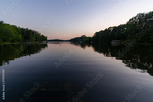 View  from shoreline of a northern lake in Washburn County  Wisconsin  in the evening.