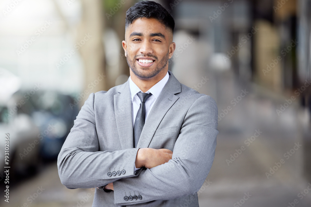 Portrait, smile and businessman with arms crossed in city outdoor for career, travel and pride in Saudi Arabia. Face, confidence and happy professional in suit, entrepreneur and attorney on street Portrait, smile and businessman with arms crossed in city outdoor for career, travel and pride in Saudi Arabia. Face, confidence and happy professional in suit, entrepreneur and attorney on street
