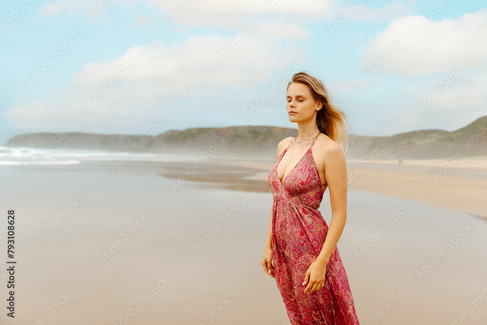 portrait of white girl with blonde hair and closed eyes feeling the breeze on the seashore in summertime portrait of white girl with blonde hair and closed eyes feeling the breeze on the seashore in summertime