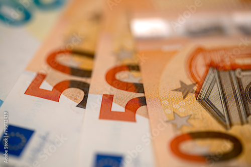 Macro detail of 50 euro bills on a table for backgrounds, textures and concepts of European and world economy