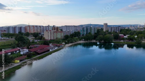 Discover urban tranquility with drone footage capturing a serene lake amidst city skyscrapers. Petržalka Draždiak Bratislava photo