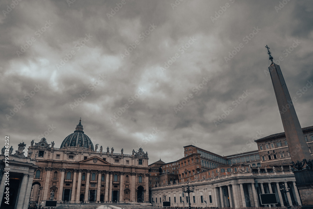 Panoramic view of St. Peter's Basilica and Square in Vatican City. Cloudy day.. Dark evening