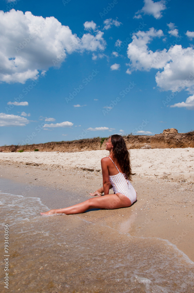 Summer vacation of woman in sea swimsuit. Sexy woman at sea beach. Suntan at summer beach. Beach vacation of sexy girl. Sea travel resort. Woman on summer vacation at beach. Miami