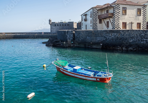 Barca de pesca fondeada en el puerto pesquero del Puerto de la Cruz en Tenerife, islas Canarias photo