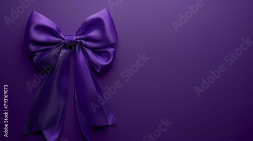   A tight shot of a purple ribbon bow against a solid purple backdrop  suitable for displaying text or an accompanying image on a wall