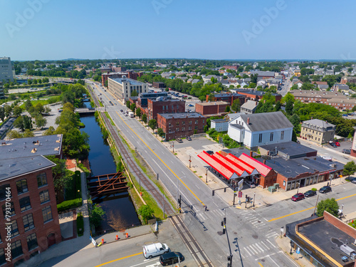 Historic waterfront building on Dutton Street at Upper Pawtucket Canal in Lowell National Historical Park in historic city center of Lowell, Massachusetts MA, USA.  photo