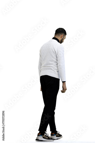 A man, in full height, on a white background, is walking