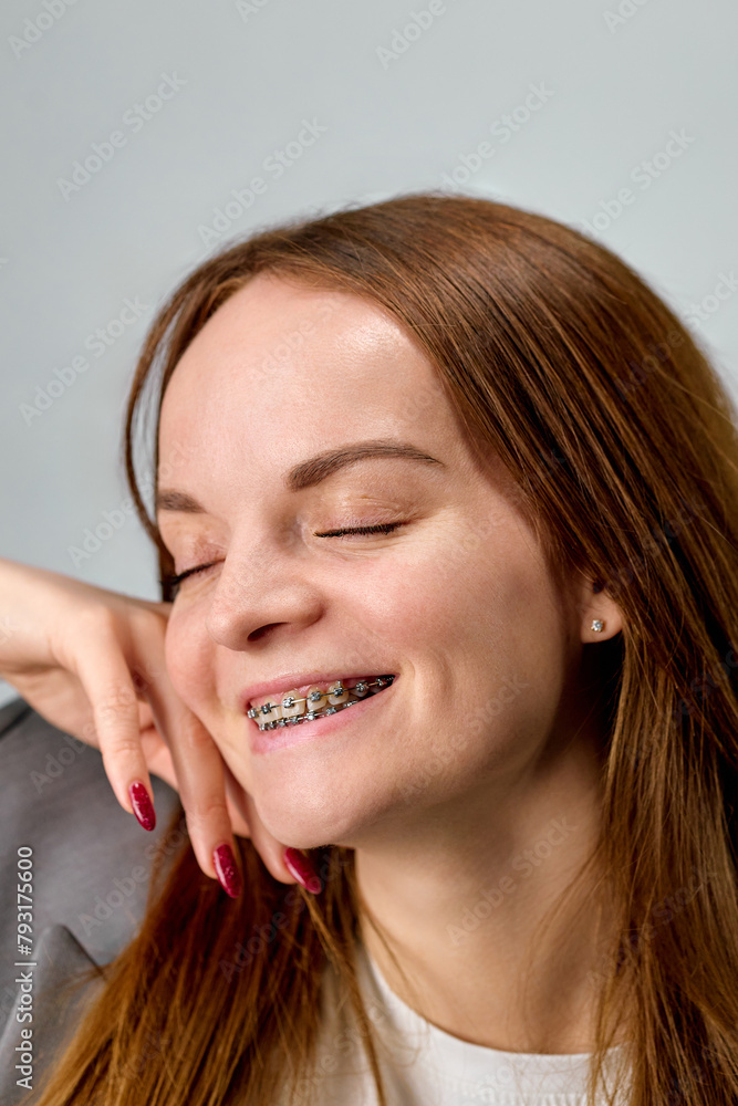 Caucasian pretty young business woman with braces smiling with her mouth wide open Caucasian pretty young business woman with braces smiling with her mouth wide open