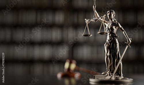 Legal Concept: Themis is the goddess of justice and the judge's gavel hammer as a symbol of law and order on the background of books © Sikov