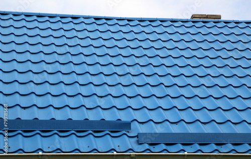 The roof of the house is covered with metal tiles