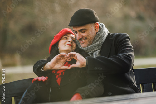 A Man and Woman Having Fun on a Park Bench