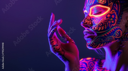 An image of ethereal beauty featuring a woman whose appearance is transformed into a living artwork with ethnic pattern body art and neon makeup under UV light.