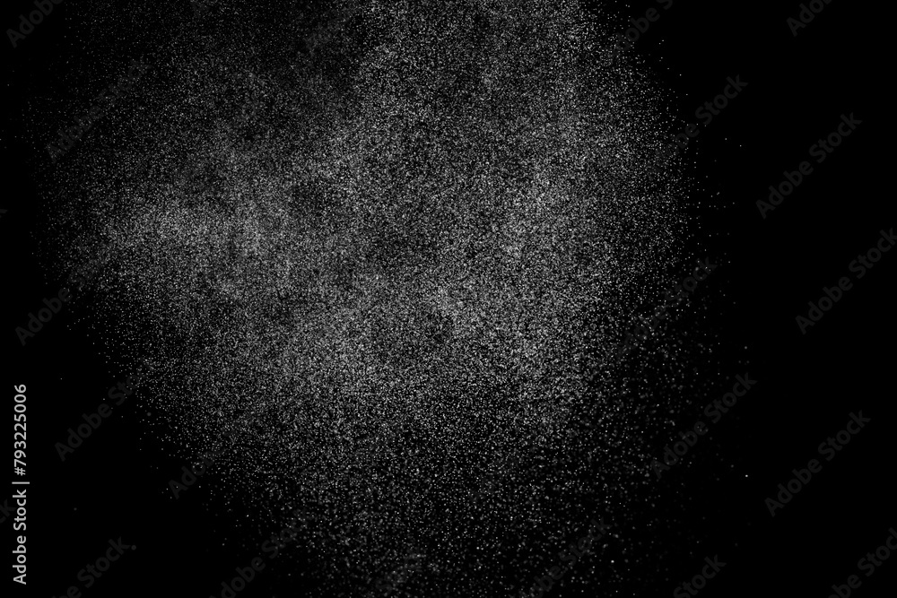 Black and white grunge texture background. Abstract splashes of water on dark backdrop. Light clouds overlay.	