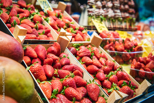 Close up. Fresh strawberries on showcase, Spanish food market.