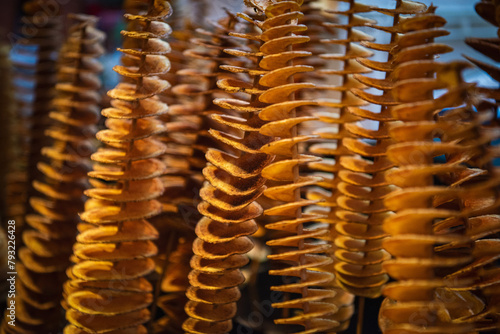 Close up. Potato spirals on skewers. Barcelona market.