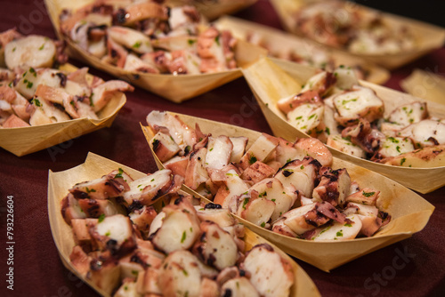 Close up. Appetizer, pieces of octopus in portions.