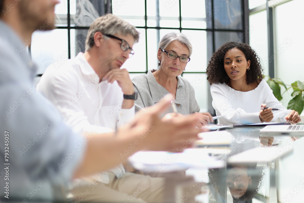 discussion of business people in the office sitting at the table