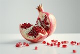 Fresh pomegranate cut in half, perfect for food and nutrition concepts