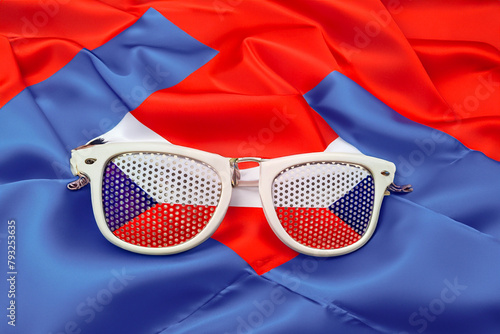 Czech Republic flag printed sunglasses on background of the Czech flag close-up photo