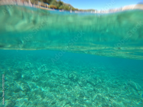 Blue sky with sand underwater sea, split view over and under water surface, corfu,Greece