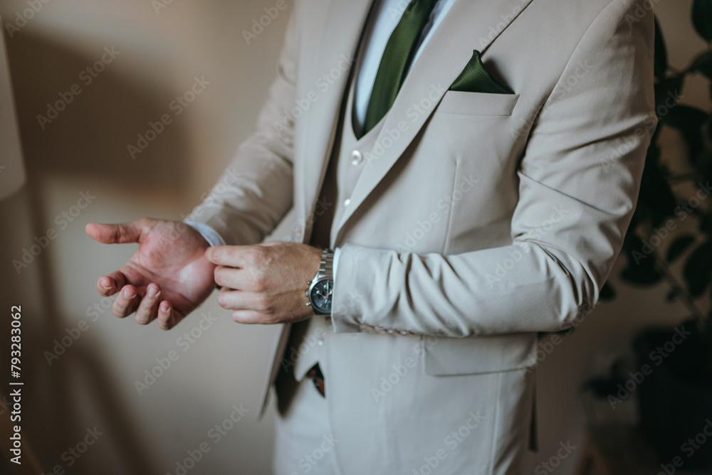 A young businessman is getting dressed for a business meeting.
A young businessman is getting dressed for a business meeting.