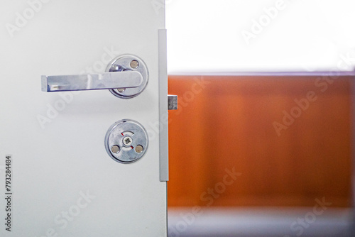 close-up of the door lock to the toilet room. Repair and reliability © Nataliia Makarovska