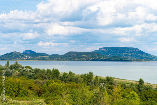 Summer Balaton landscape with volcanic mountains and clouds in the background