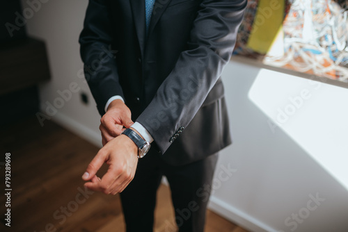 Guy is getting dressed for a business meeting.