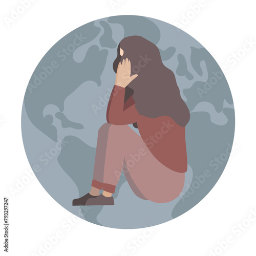 The concept of loneliness: a woman suffering from depression feels alone in the whole world.Monochrome colors. The person covered her face with her hands. The emblem of the globe is in the background.