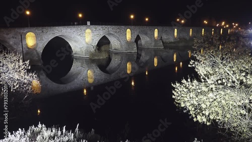 Illumination on Stone bridge on Duero river. Zamora is a city in Castile and Leon, Spain. Evening time. photo