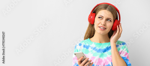Young woman listening to au...